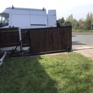 Installing track for sliding wooden gate on concrete base – SK Welding craftsmanship