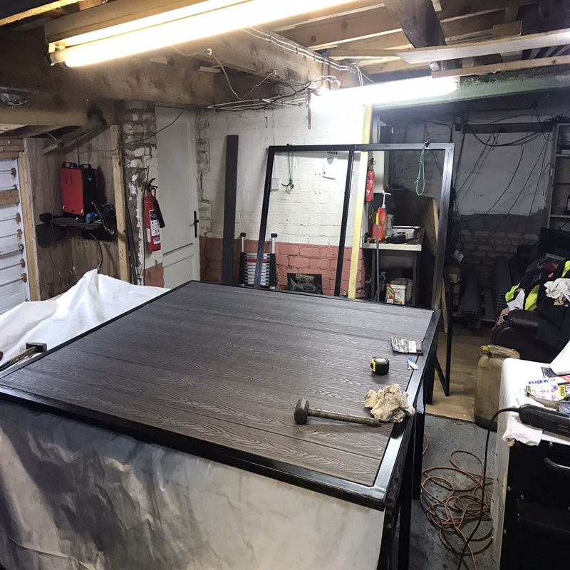 Electric composite panel gate open – custom swing gate by SK Welding