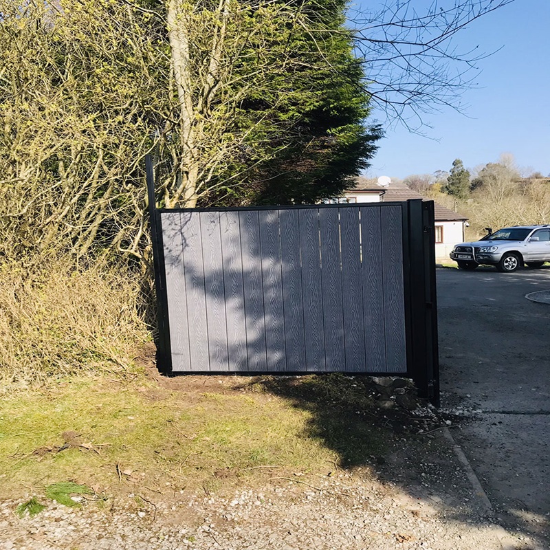 Close-up of electric arm mechanism on composite gate – SK Welding precision install